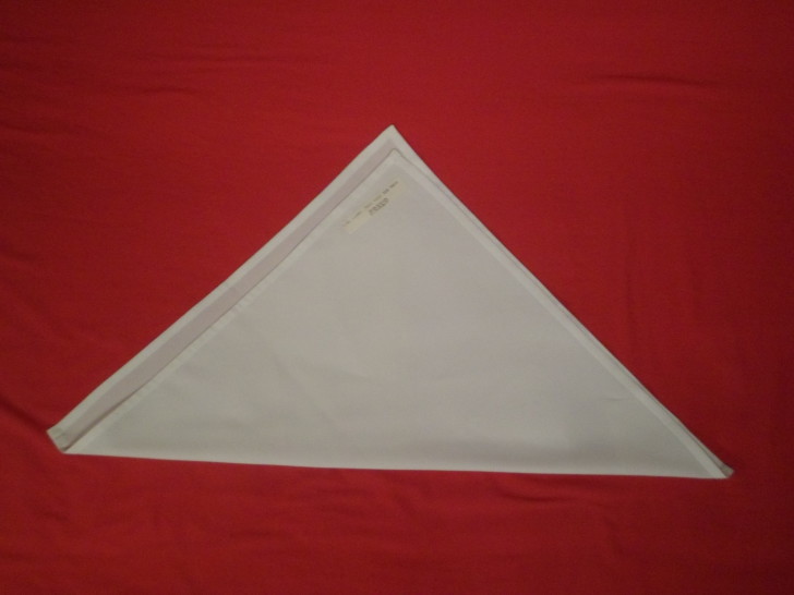 Napkin Origami The Cone Fold Step three lay the already folded napkin out in front of you so the longest side of the triangle is closest to you