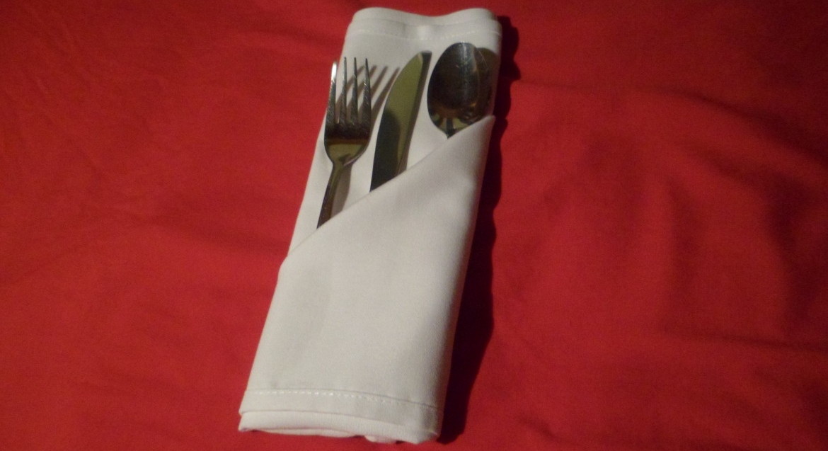 Folding napkins for silverware. This is a very common fold to find in hotels.