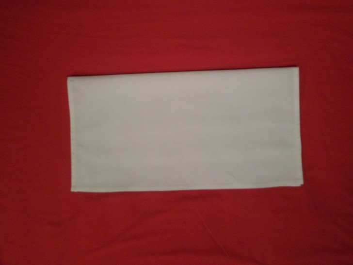 Folding napkins for silverware Step Two fold the napkin in half towards yourself. 