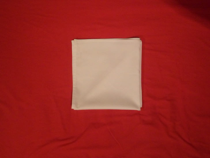 Folding napkins for silverware Step Six Flip the entire napkin over.