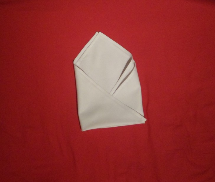 Folding Napkins for Silverware - The Silverware Roll Step Six Fold the left hand side over so the napkin looks like an envelope 