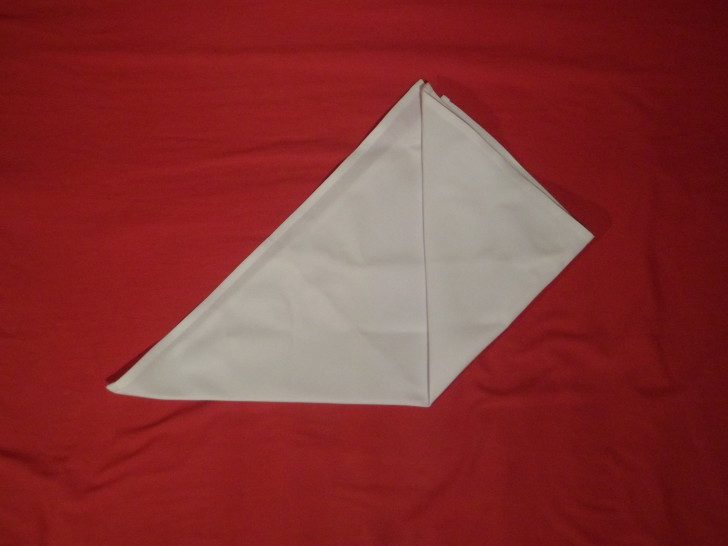 How To Fold Napkins The Crown Fold Step Three Fold the bottom right corner up to the centre. Try your best to get it all symmetrical 