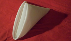 The fantastically tidy and fairly simple to achieve pyramid napkin fold.