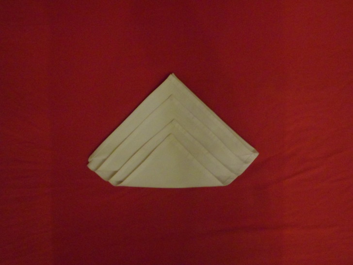 Napkin Origami The Diamond Fold Step Seven Fold the final layer up creating a sort of flat bottomed diamond shape