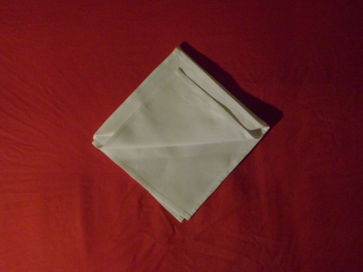 Napkin Origami The Diamond Fold Step Five fold the second layer up placing it slightly lower than the previous
