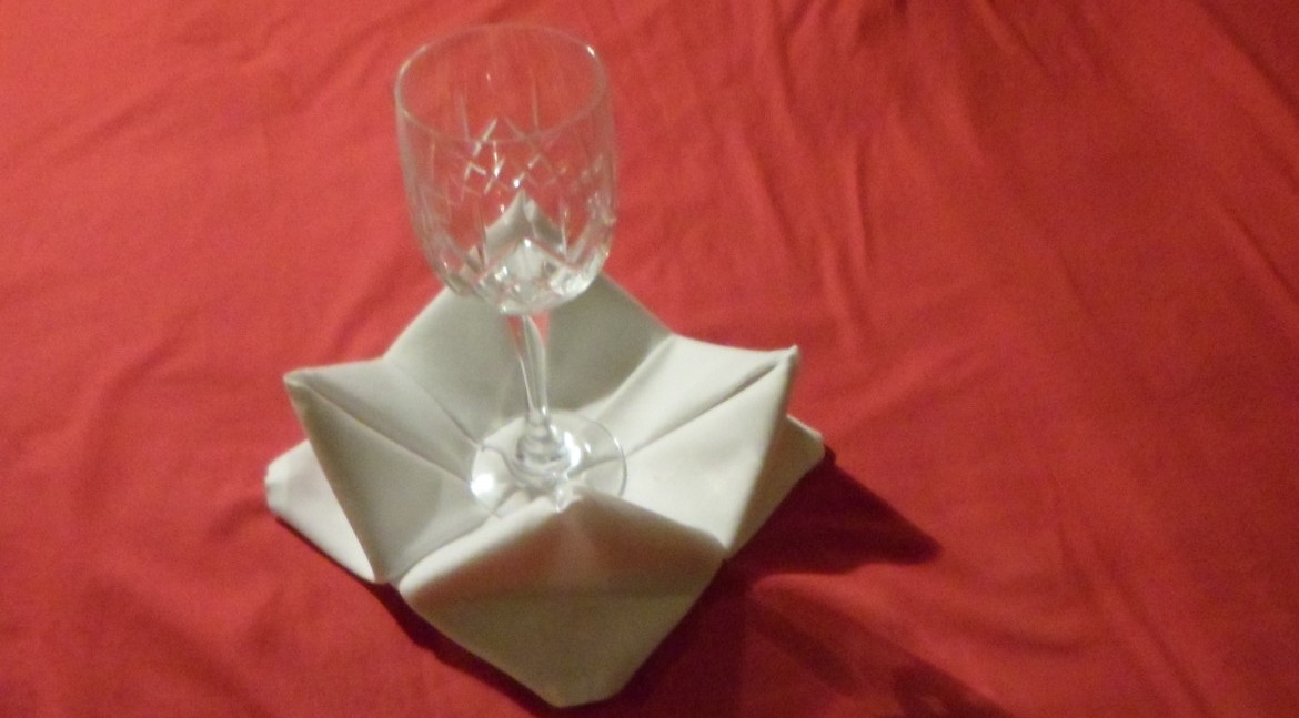 A brilliant way to recover a table display if you cant find coasters. The rose napkin fold looks exactly how it sounds and is a rather challenging fold to complete