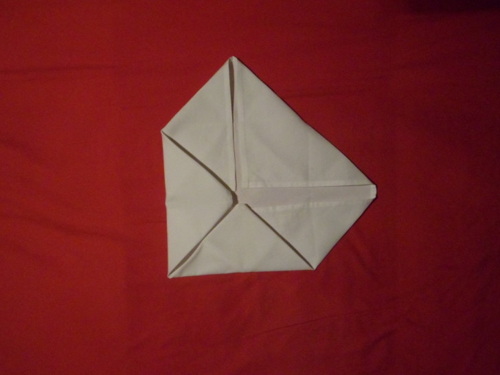 Napkin Folding Rose Fold Step Seven fold the left corner in to the centre