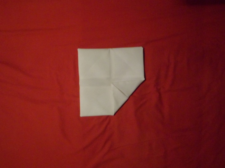 Napkin Folding Rose Fold Step Eleven fold the bottom right comer into the centre